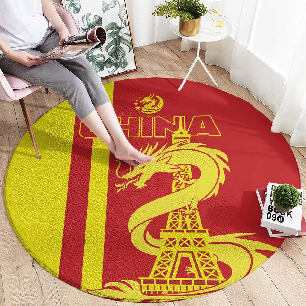 Red and yellow striped round area rug with golden dragon and Eiffel Tower graphic