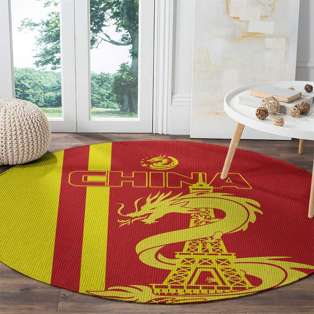 Red and yellow striped round rug with golden dragon and Eiffel Tower in center