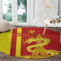 Red and yellow striped round rug with golden dragon and Eiffel Tower in center