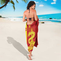 Custom sarong around waist, red and yellow dragon with Eiffel Tower motif
