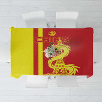 Red tablecloth folded view with bold “CHINA” text, dragon and Eiffel Tower illustration.