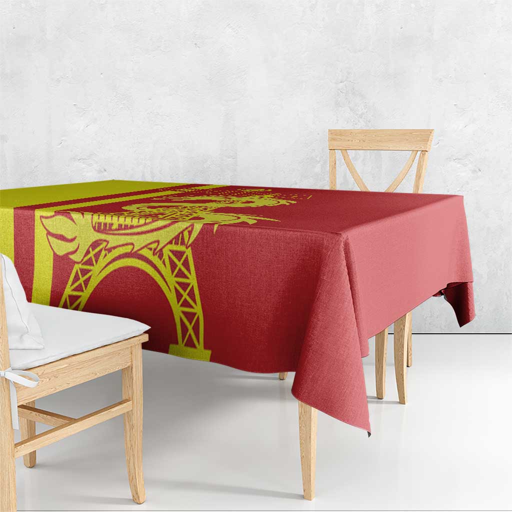 Red tablecloth with yellow panel, dragon artwork, and Eiffel Tower motif along the edge.