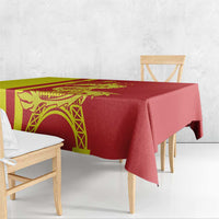 Red tablecloth with yellow panel, dragon artwork, and Eiffel Tower motif along the edge.