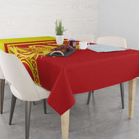 Red tablecloth with yellow side panel featuring dragon artwork and Eiffel Tower design.