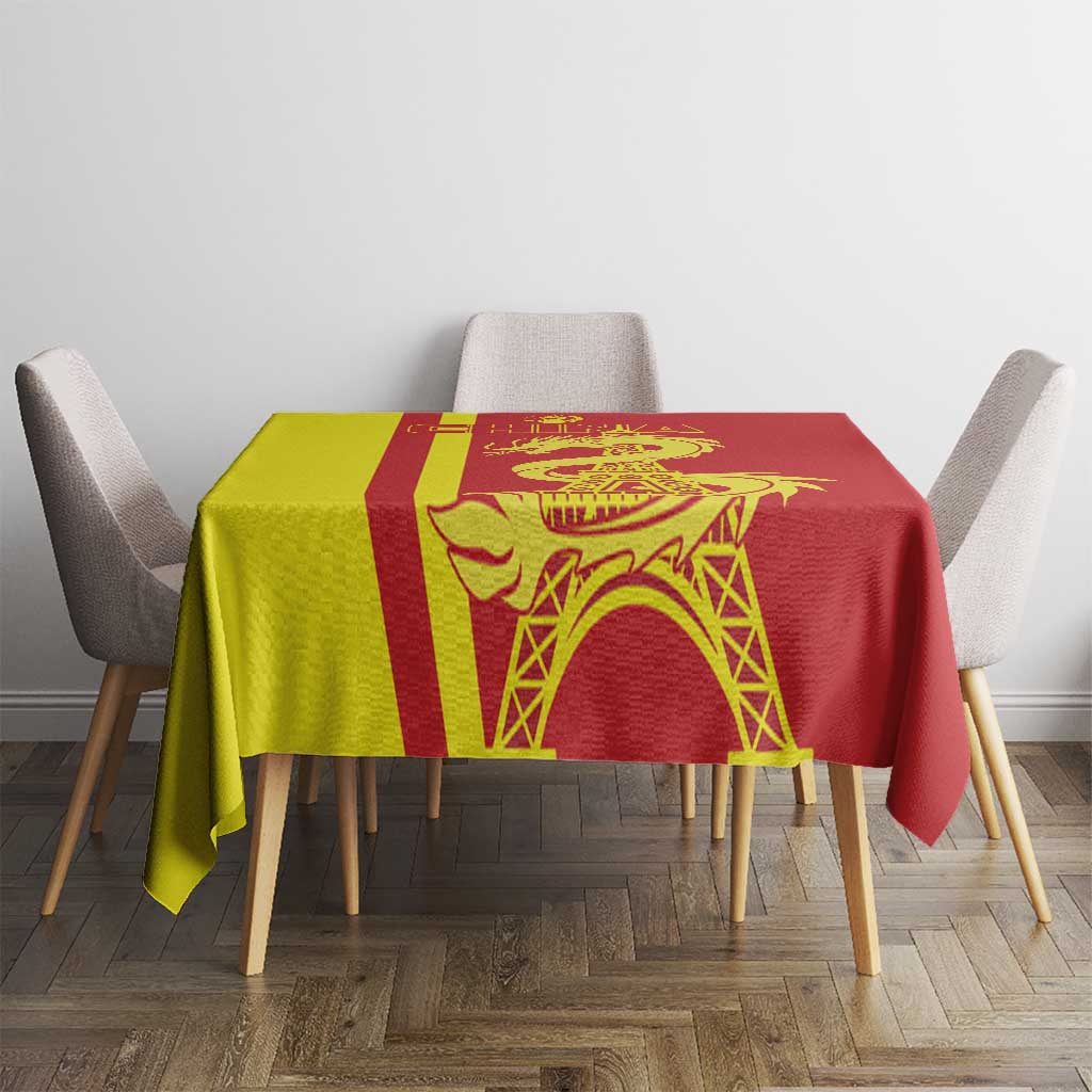 Red tablecloth with yellow and red panels, dragon motif and arched tower pattern.
