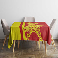 Red tablecloth with yellow and red panels, dragon motif and arched tower pattern.