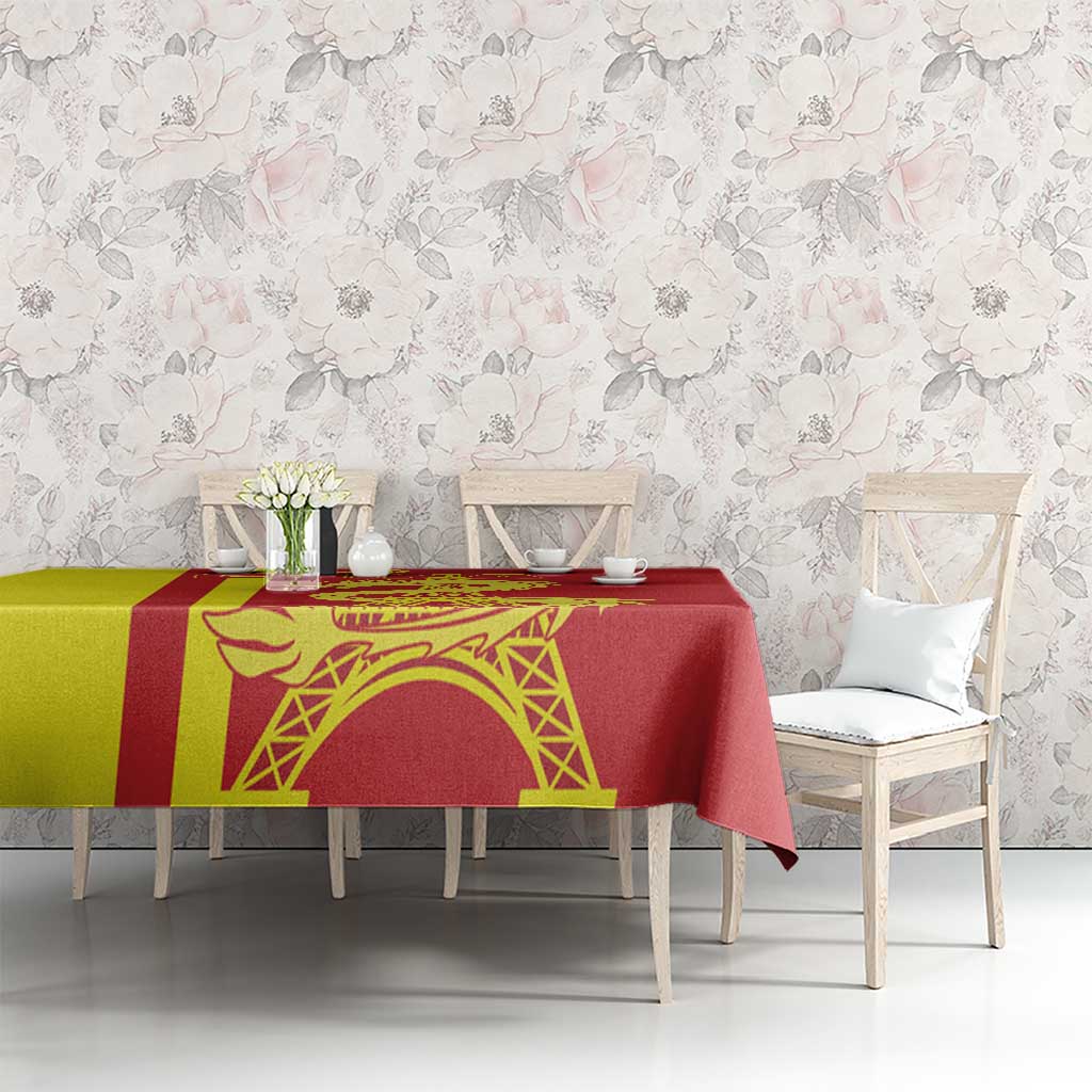 Red tablecloth with yellow border strip and dragon artwork printed across the table.