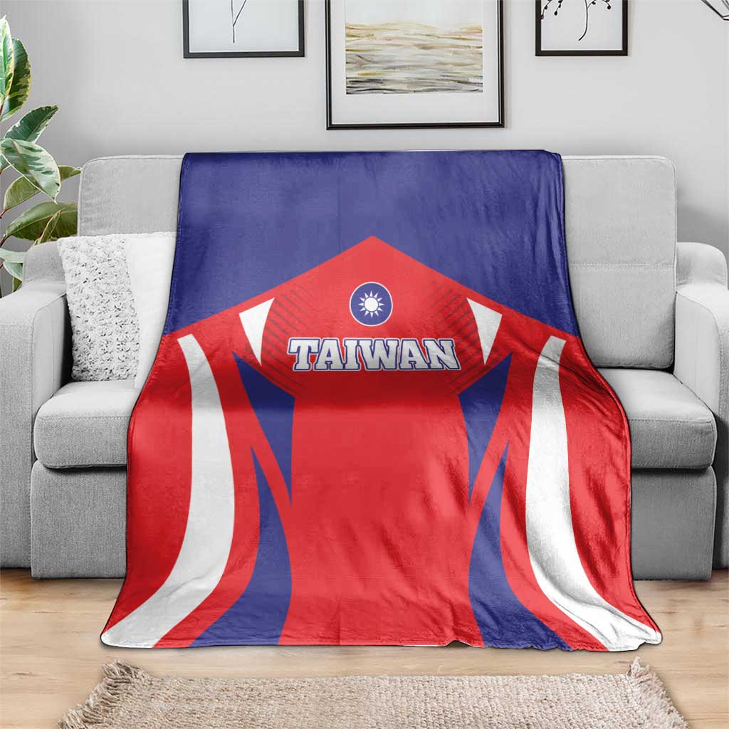 Taiwan flag style blanket on sofa, blue red and white rays with Taiwan emblem