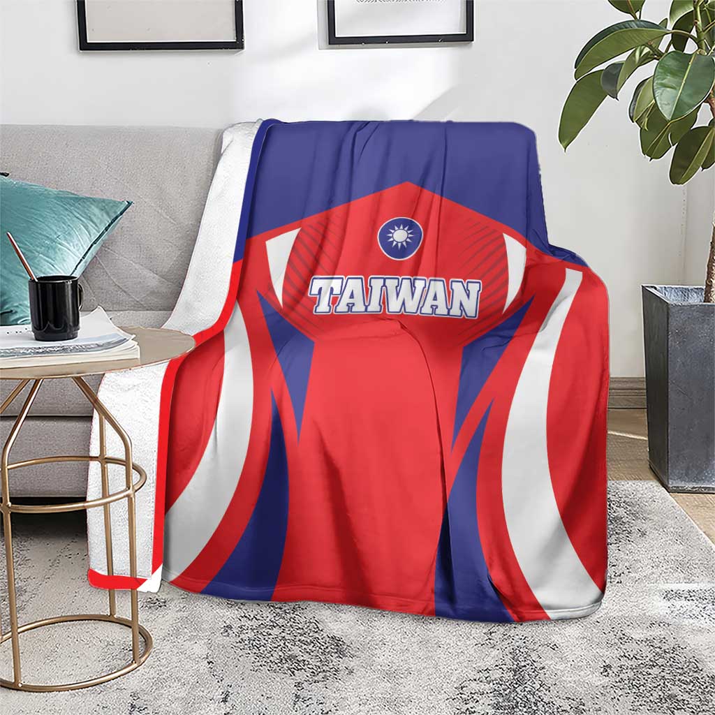 Taiwan flag style blanket on sofa, blue red and white rays with Taiwan emblem