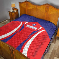 Quilted Taiwan flag comforter on a bed, red and blue panels with white stripes