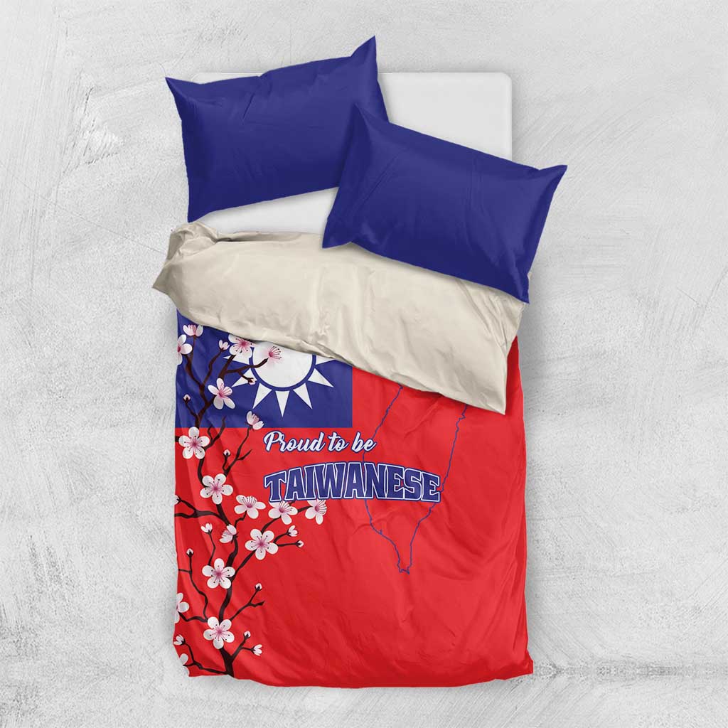 Bedding set flat lay: red duvet with plum blossoms and Taiwan map plus two blue pillows