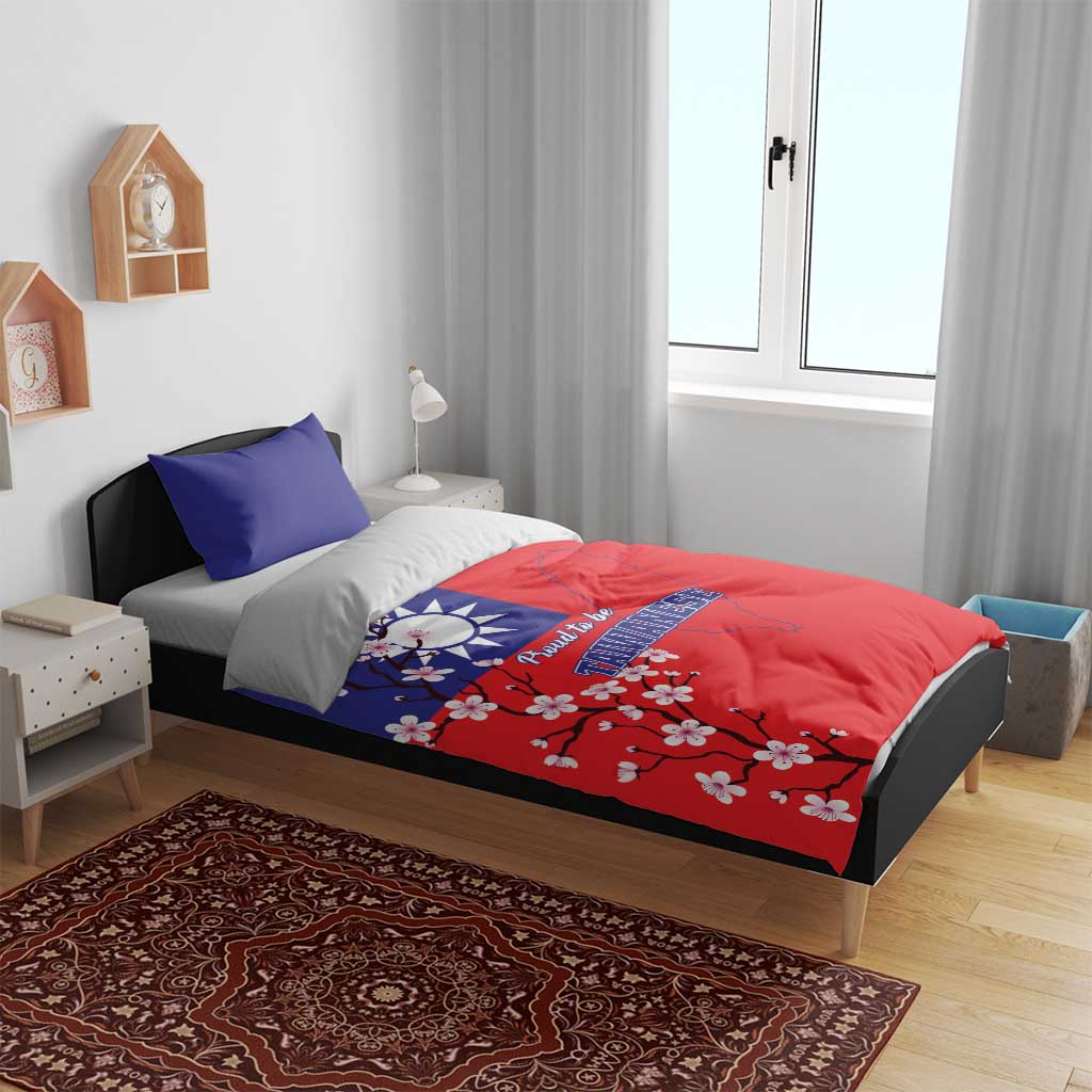 Red-and-blue duvet with Taiwan map and plum blossoms, shown with two pillowcases