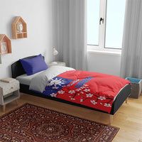 Red-and-blue duvet with Taiwan map and plum blossoms, shown with two pillowcases
