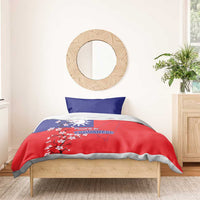 Red and blue bedding set with Taiwan map, plum blossom flowers, and two pillowcases