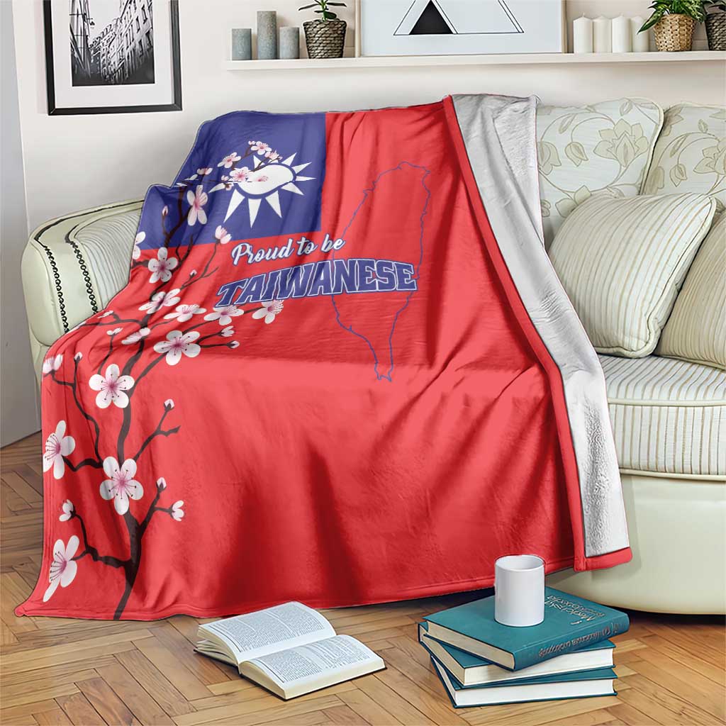 Red and blue Taiwan flag blanket draped over sofa, plum blossom and map design