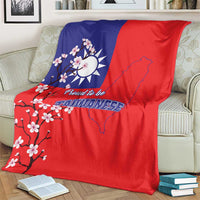 Red and blue Taiwan flag blanket over sofa, plum blossoms and Taiwan map