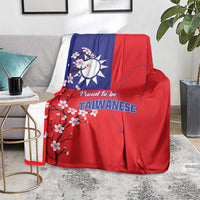 Red and blue Taiwan flag blanket on couch, featuring plum blossoms and Taiwan map