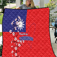 Red and blue quilt blanket with Taiwan map, plum blossoms, and “Proud to be Taiwanese” print