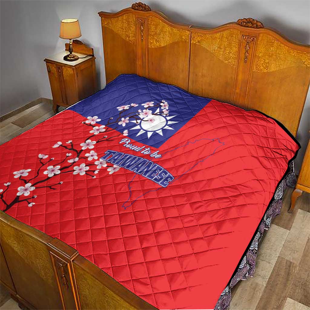 Red quilt blanket with blue panel, Taiwan map graphic, plum blossoms, and “Proud to be Taiwanese”