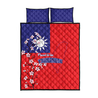 Quilt bed set with red and blue halves, Taiwanese text logo, and floral cherry blossoms