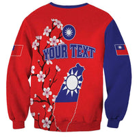 Unisex red/navy sweatshirt back with cherry blossoms, Taiwan map, and 'YOUR TEXT' design.