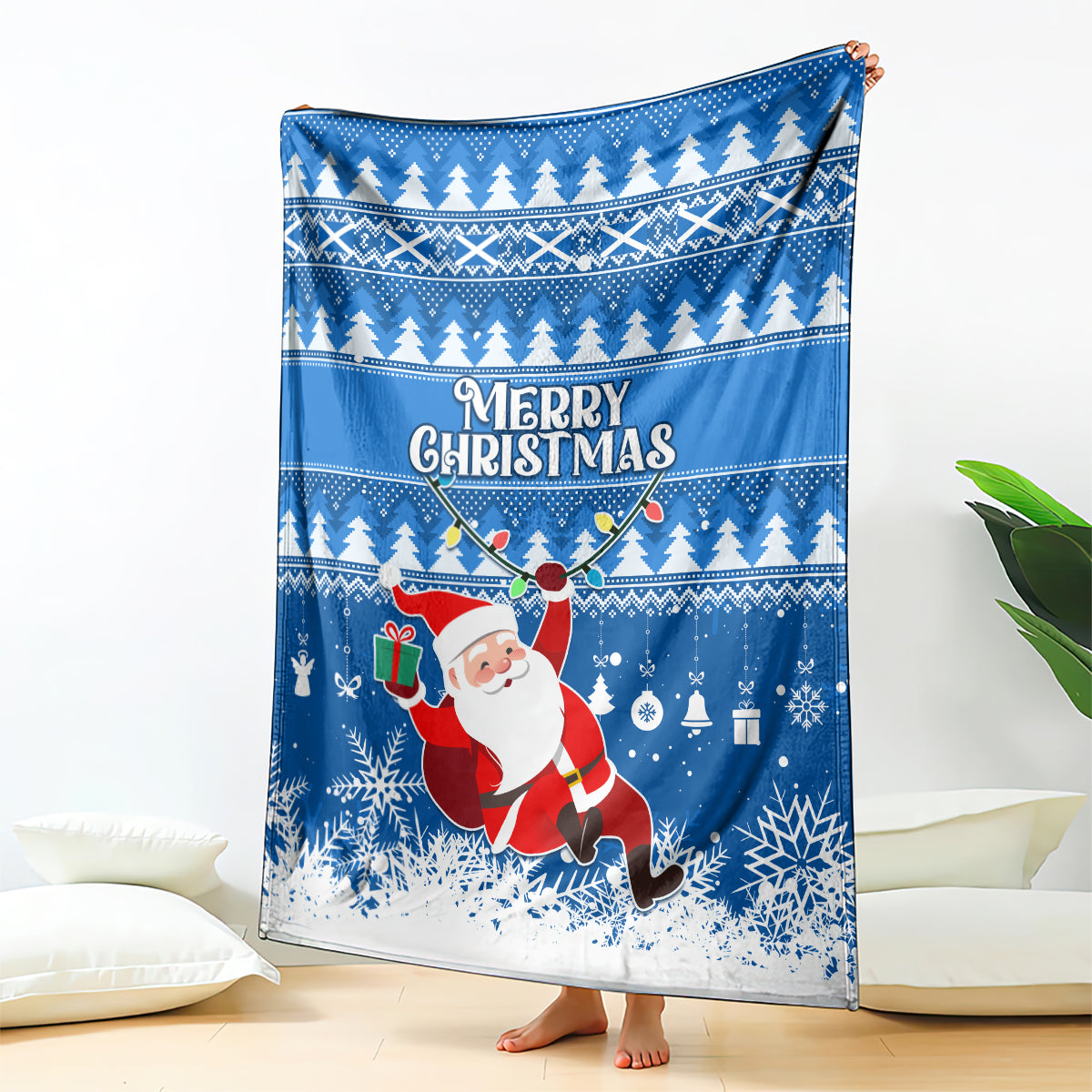 Blue Christmas blanket with Merry Christmas text, Santa, and winter tree pattern
