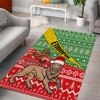 Christmas area rug with Ethiopia lettering; green diamond pattern and red animal scene