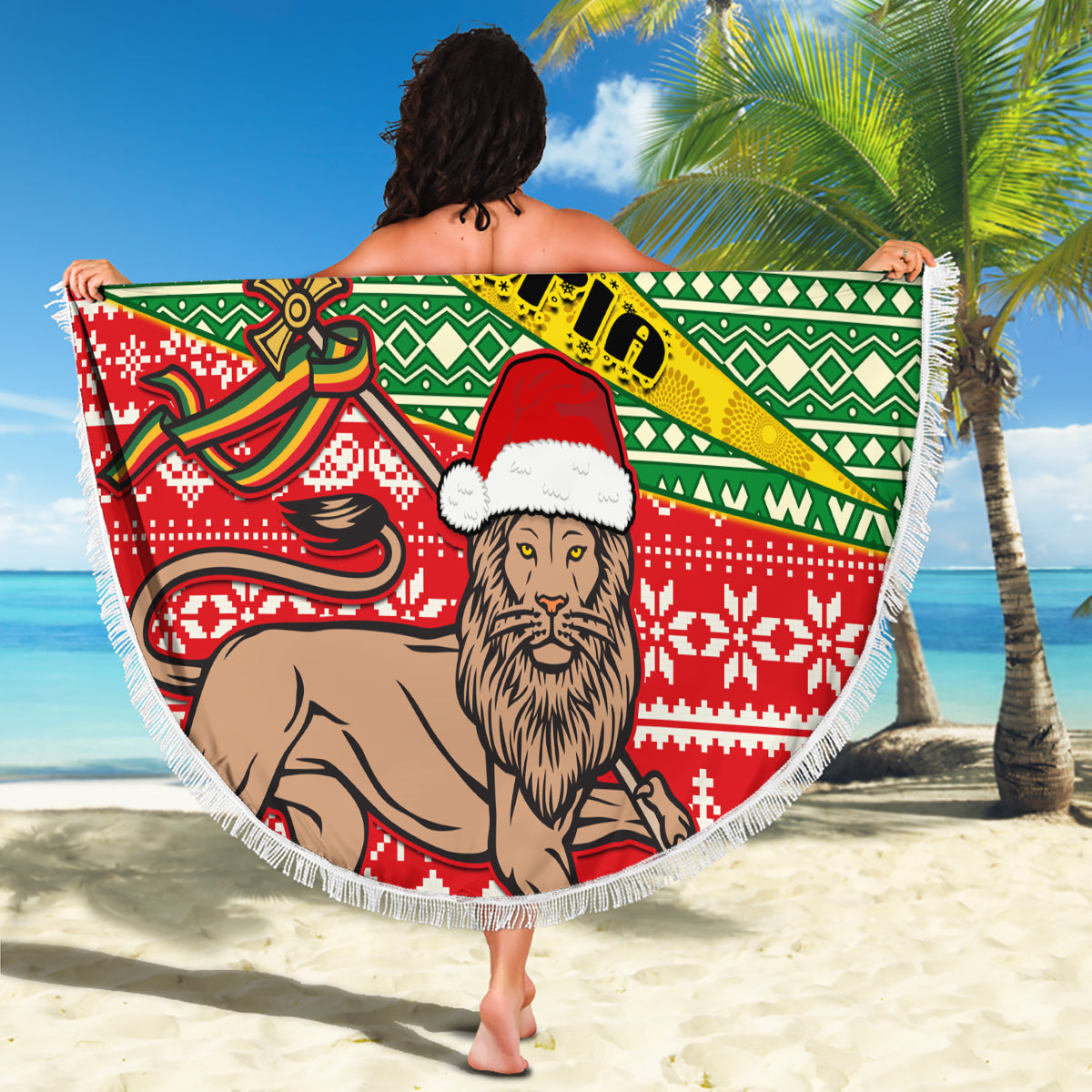 Round beach blanket with green patterned band and red lion wearing a Santa hat, fringed trim
