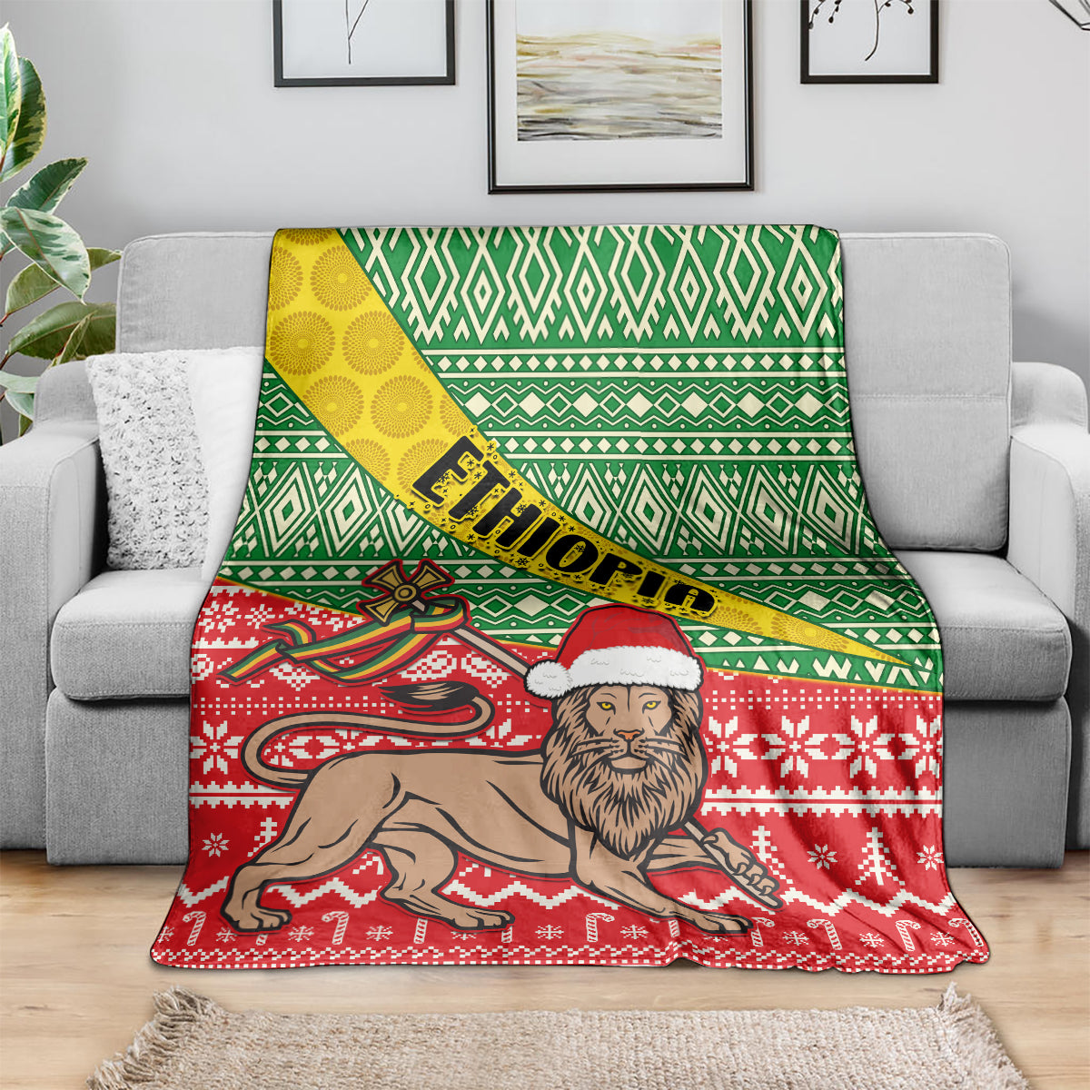 Ethiopian Christmas blanket draped on couch, showing green lattice stripes and red lion illustration
