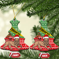 Bell-shaped ceramic Christmas ornament with green red Ethiopian pattern, ETHIOPIA band, lion figure.