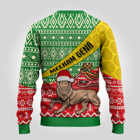 Ugly Christmas sweater with back view: green diamond pattern, yellow sleeve, lion print