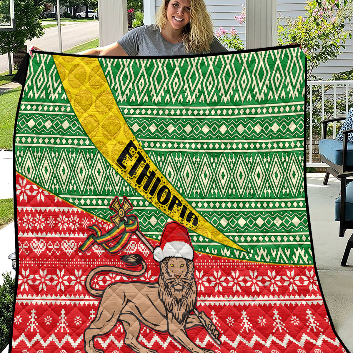 Green, red and yellow Ethiopian Christmas quilt with lion and geometric pattern