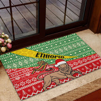 Rubber doormat with green and red winter pattern and ETHIOPIA banner over bearded man illustration