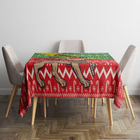 Christmas tablecloth for dining table with red and green jagged chevrons and camel illustration