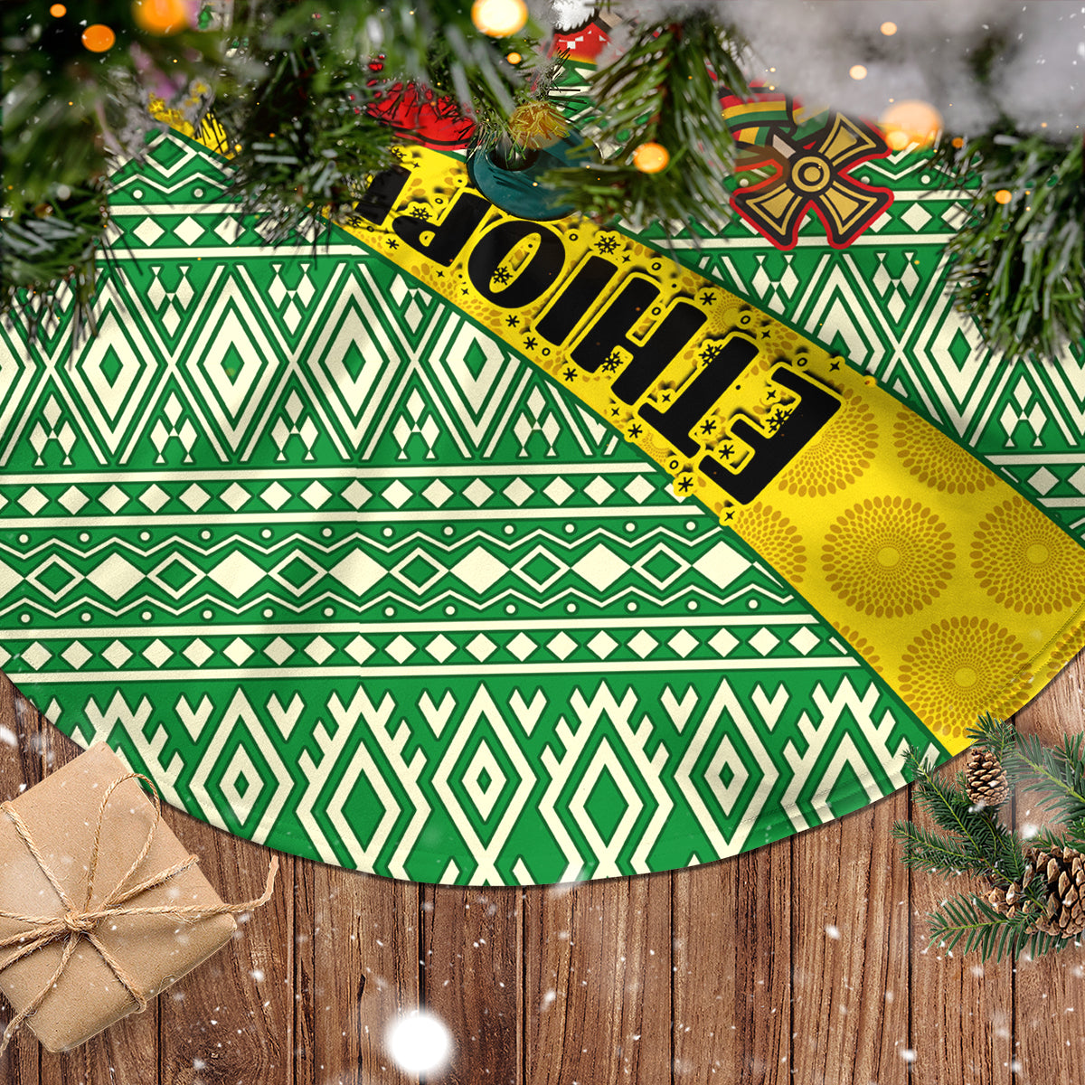 Christmas tree skirt close-up with green geometric bands, red motifs, and yellow accents