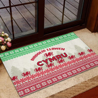 Christmas rubber doormat with 'Nadolig Llawen' and Welsh dragon on green and red border