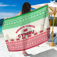 Green and red Christmas sarong with Welsh dragon and festive geometric pattern