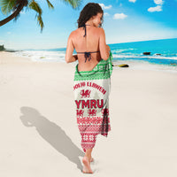 Cream, green, and red Christmas sarong with Welsh dragon print and trim design