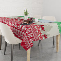 Festive Christmas tablecloth draped on dining table with red and white pattern