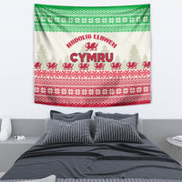 Hanging Welsh Christmas tapestry with cream background, green top stripe, red pattern bands.