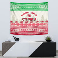 Wall-hung Welsh Christmas tapestry featuring Cymru text, red dragon, and pine tree silhouettes.