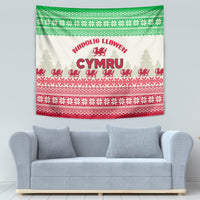 Hanging Welsh Christmas tapestry with cream, green trim, red geometric patterns, and Cymru title.