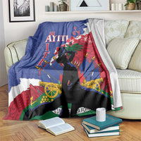 Blue, red, and white Polynesian-pattern blanket with central silhouette graphic