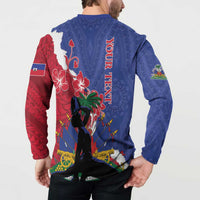 Blue button sweatshirt with red back panel and vertical Haiti text, long sleeves