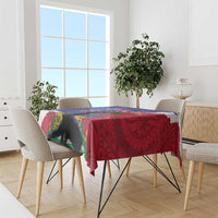 Rectangular tablecloth draped on dining table with red and blue graphic pattern