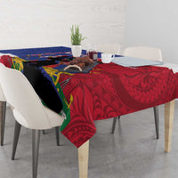 Rectangular tablecloth on dining table with red, blue, and black tribal motifs