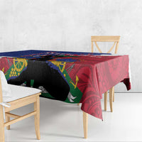 Tablecloth corner drape showing red and dark-blue design with black animal