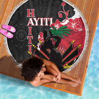 Round black beach blanket with fringe edge, red hibiscus and palm tree dancer scene, striped details