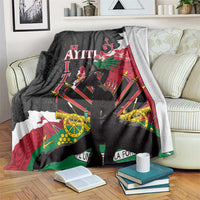 Black blanket with Polynesian dashiki-style floral and geometric print, white and red accents
