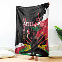 Black blanket draped on chair, hibiscus floral and geometric pattern with red and green